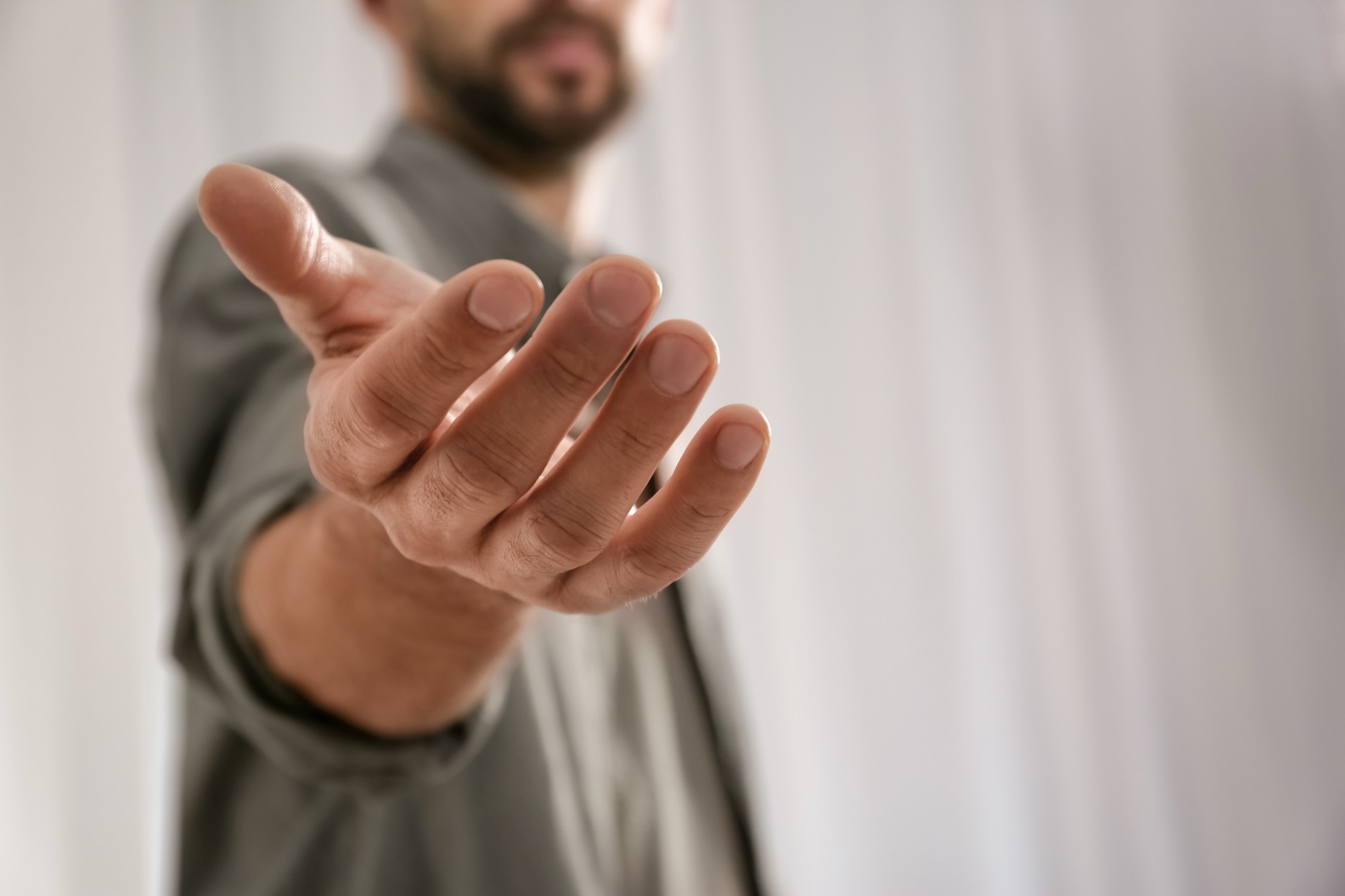 An open hand extended in invitation